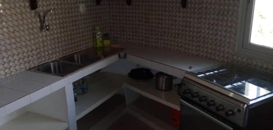 Case traditionnelle diola au bord de l'océan Cap Skirring Esterno foto